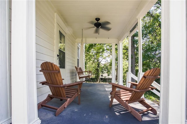 view of patio with ceiling fan and a porch