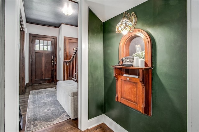 bathroom featuring hardwood / wood-style floors and ornamental molding