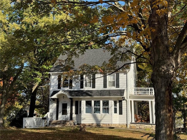 view of front of home with a balcony