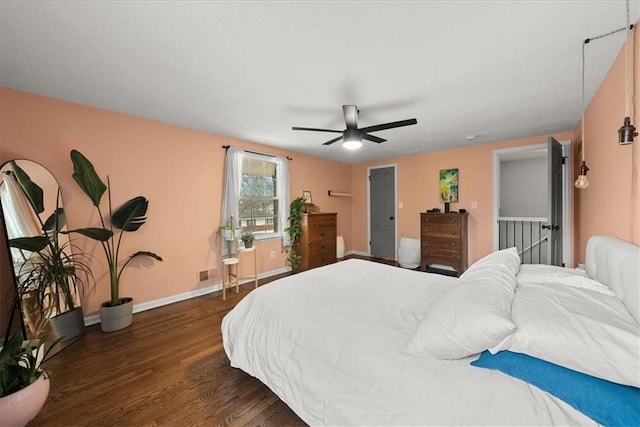 bedroom featuring dark wood-type flooring and ceiling fan