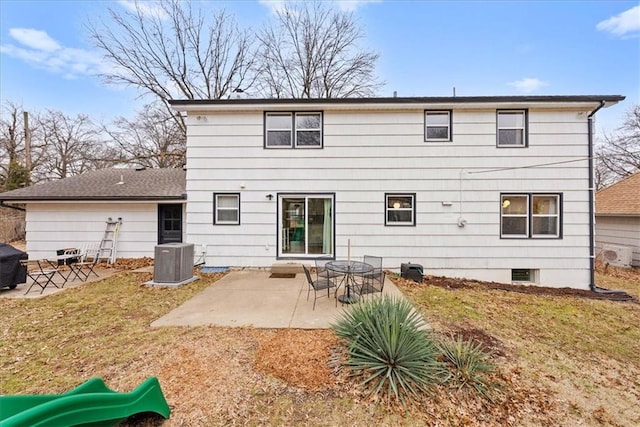 back of house with cooling unit, a playground, a patio area, and a lawn