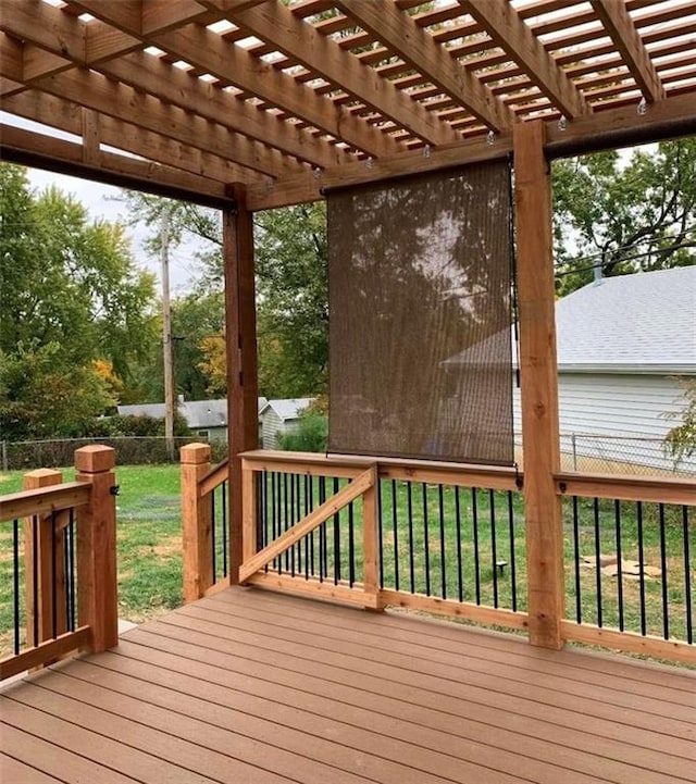 wooden deck with a storage shed and a pergola