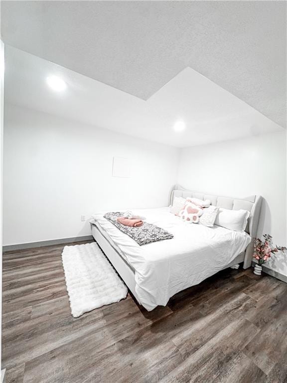 unfurnished bedroom featuring dark wood-type flooring