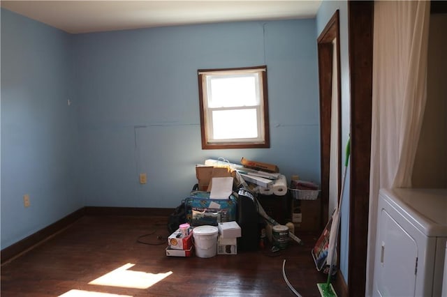 misc room featuring dark wood-type flooring and washer / clothes dryer