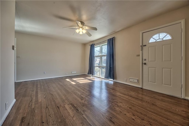 foyer with baseboards, a ceiling fan, and dark wood-style flooring