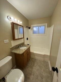 bathroom with bathtub / shower combination, vanity, and toilet