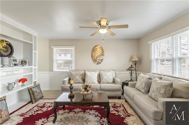 living room with carpet flooring and ceiling fan