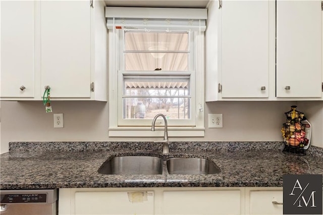 kitchen featuring dark stone counters, dishwasher, sink, and white cabinets