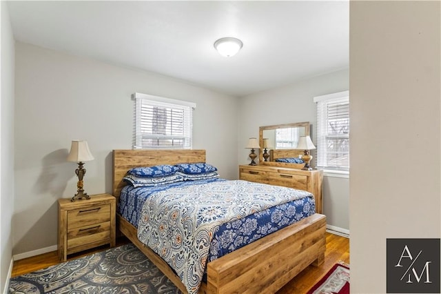 bedroom with hardwood / wood-style floors