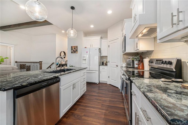 kitchen with sink, white cabinetry, stainless steel appliances, dark hardwood / wood-style flooring, and dark stone counters