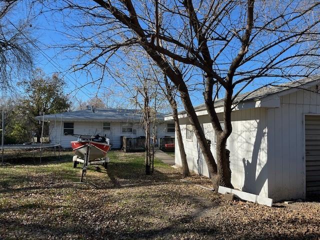 back of house featuring a trampoline