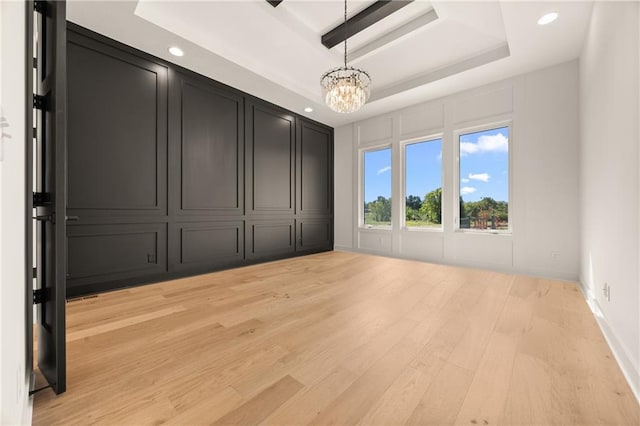 17021 Parkhill St, Overland Park, KS 66221 - unfurnished room featuring a raised ceiling, a chandelier, recessed lighting, and light wood-type flooring