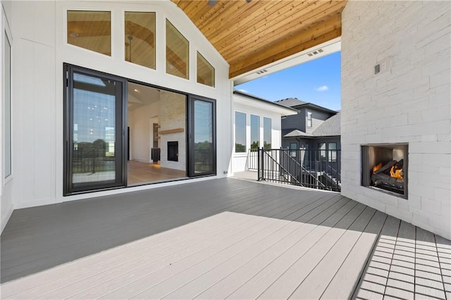 17021 Parkhill St, Overland Park, KS 66221 - deck featuring a lit fireplace