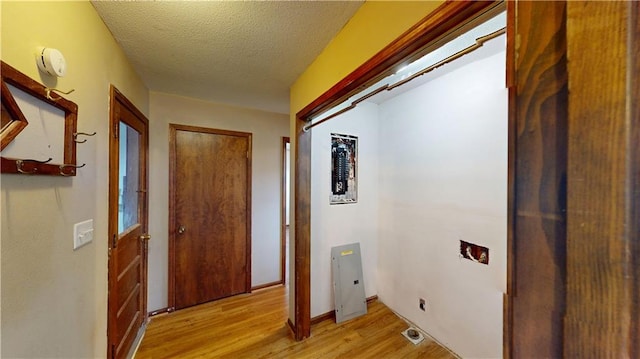 washroom featuring a textured ceiling and light wood-type flooring