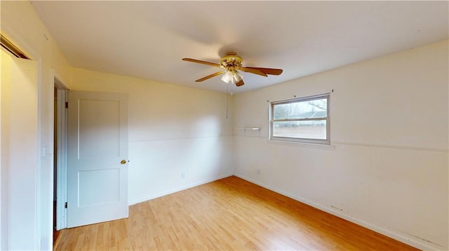 unfurnished room featuring ceiling fan and light wood-type flooring