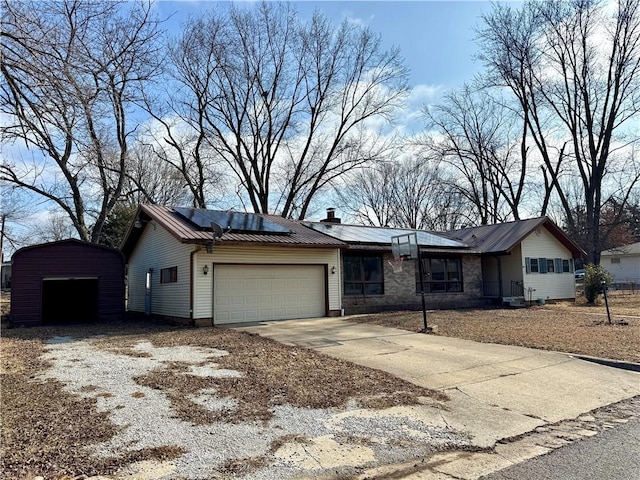 single story home featuring a garage and solar panels