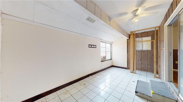 1120 N Oak St, Nevada, MO 64772 - unfurnished room with visible vents, baseboards, ceiling fan, and light tile patterned floors