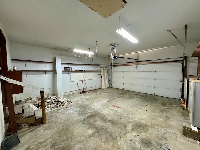 1120 N Oak St, Nevada, MO 64772 - garage with a garage door opener
