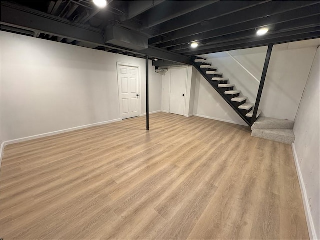 basement featuring light hardwood / wood-style flooring