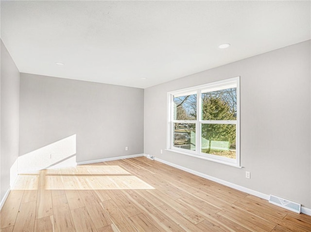 unfurnished room featuring light hardwood / wood-style floors