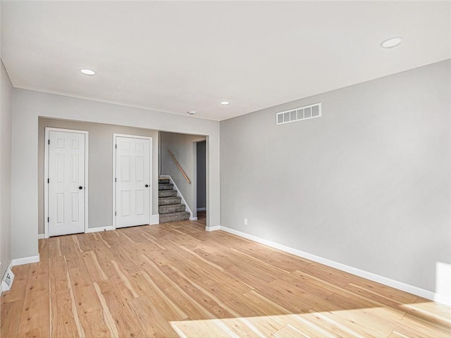 spare room with light hardwood / wood-style flooring