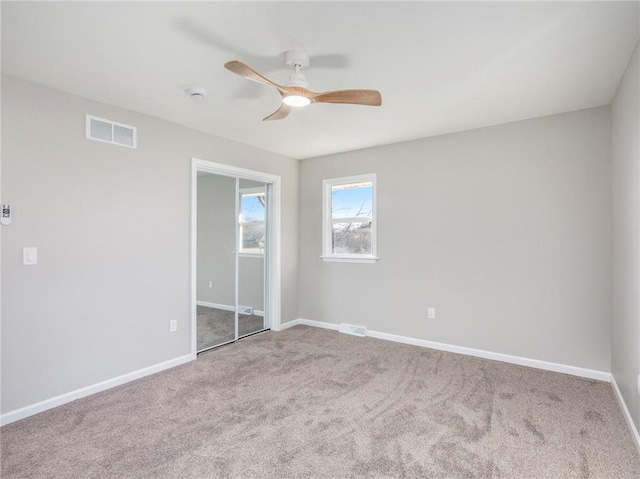 unfurnished bedroom with carpet and ceiling fan