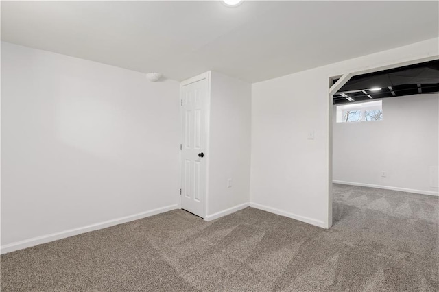 interior space with carpet and baseboards