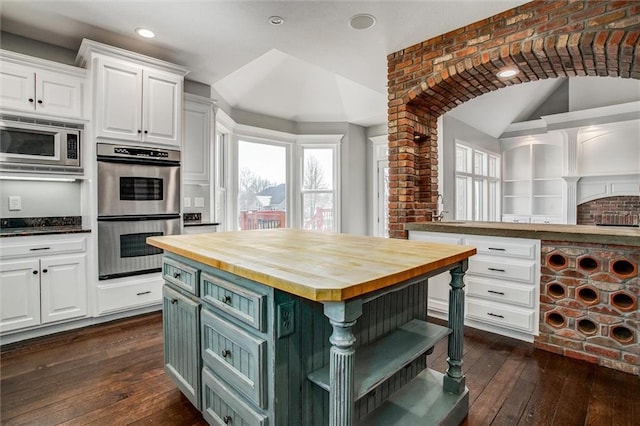 4300 SE Willow Ridge Dr, Blue Springs, MO 64014 - kitchen with appliances with stainless steel finishes, wood counters, white cabinets, a center island, and dark wood-type flooring