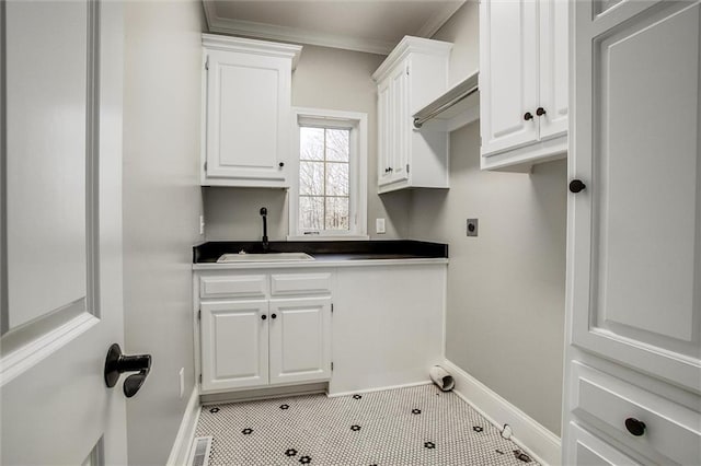 4300 SE Willow Ridge Dr, Blue Springs, MO 64014 - clothes washing area featuring gas dryer hookup, sink, cabinets, ornamental molding, and electric dryer hookup