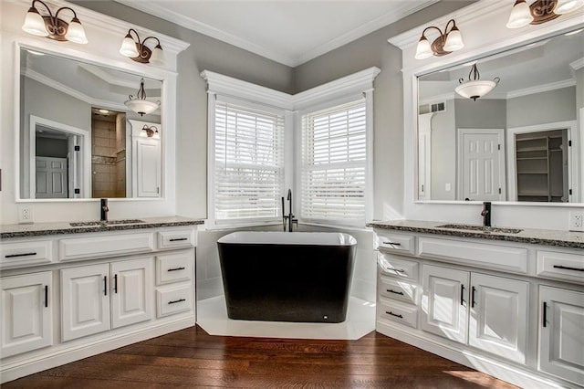 4300 SE Willow Ridge Dr, Blue Springs, MO 64014 - bathroom featuring hardwood / wood-style flooring, crown molding, and a bath