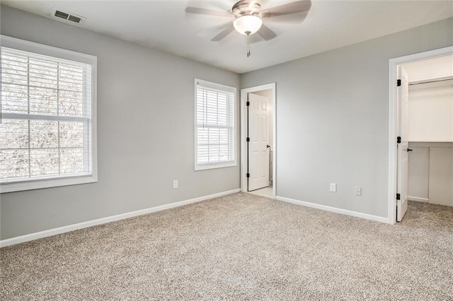 4300 SE Willow Ridge Dr, Blue Springs, MO 64014 - unfurnished bedroom with ceiling fan, a walk in closet, a closet, and light carpet