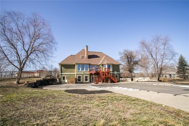 4300 SE Willow Ridge Dr, Blue Springs, MO 64014 - back of property with a yard and a patio