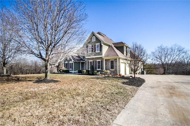 4300 SE Willow Ridge Dr, Blue Springs, MO 64014 - view of front of home featuring a garage and a front lawn