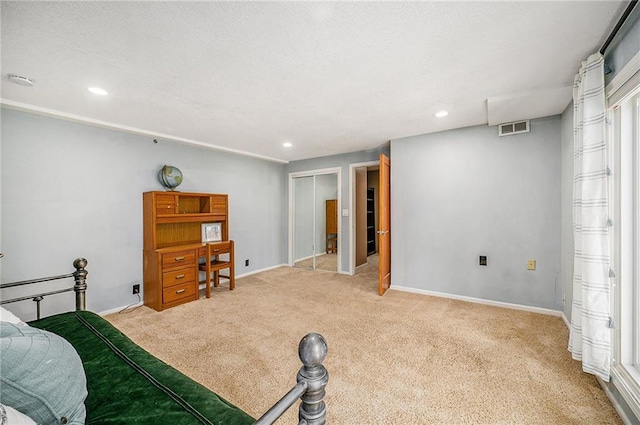 carpeted bedroom featuring recessed lighting, a closet, visible vents, and baseboards