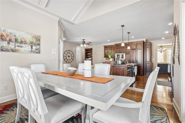 dining space featuring dark wood-style floors, recessed lighting, baseboards, and crown molding