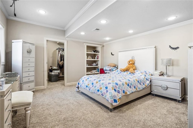 bedroom with baseboards, light colored carpet, ornamental molding, a walk in closet, and recessed lighting