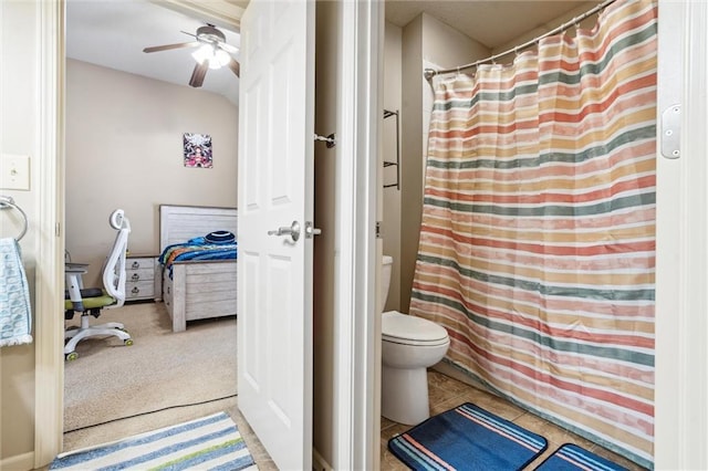 bathroom with toilet and ceiling fan