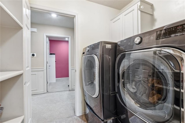 laundry area featuring carpet floors and washer and dryer