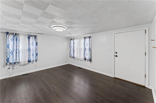 empty room featuring dark hardwood / wood-style floors