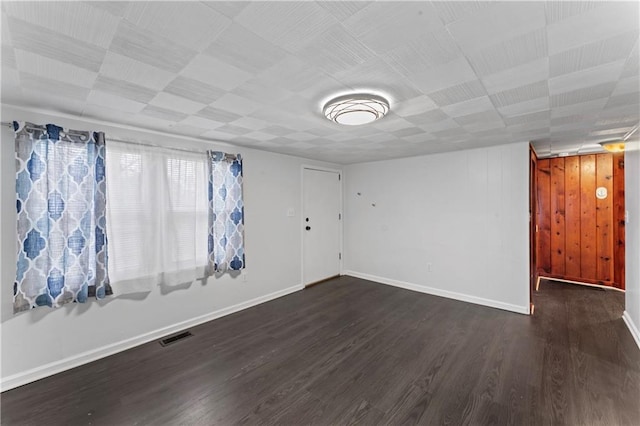 spare room featuring dark hardwood / wood-style floors