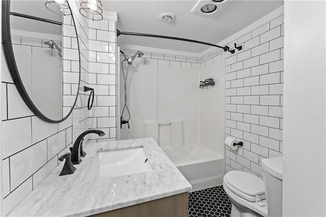 full bath featuring crown molding, tile walls, tile patterned floors, vanity, and toilet
