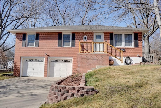 view of front of property with a garage and a front lawn