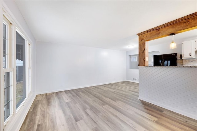 unfurnished living room featuring light hardwood / wood-style floors