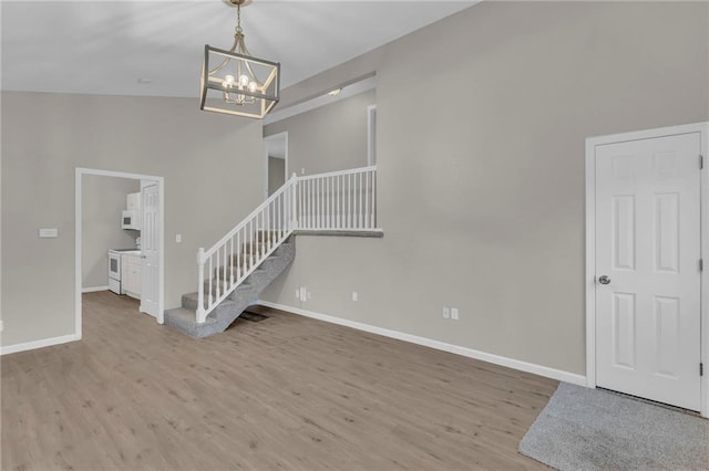 interior space featuring a notable chandelier and light hardwood / wood-style flooring