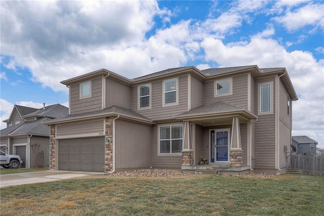 view of front facade with a front lawn, stone siding, an attached garage, and concrete driveway