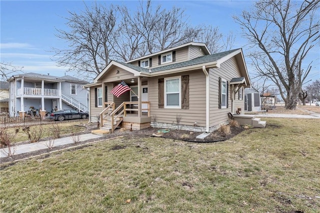 bungalow-style house featuring a front lawn