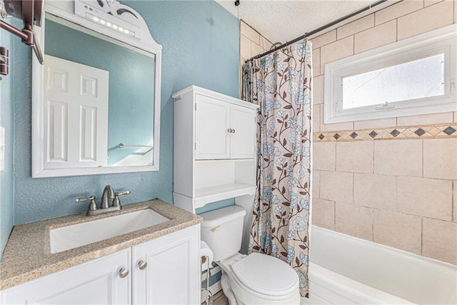 bathroom featuring shower / bathtub combination with curtain, toilet, a textured ceiling, vanity, and a textured wall