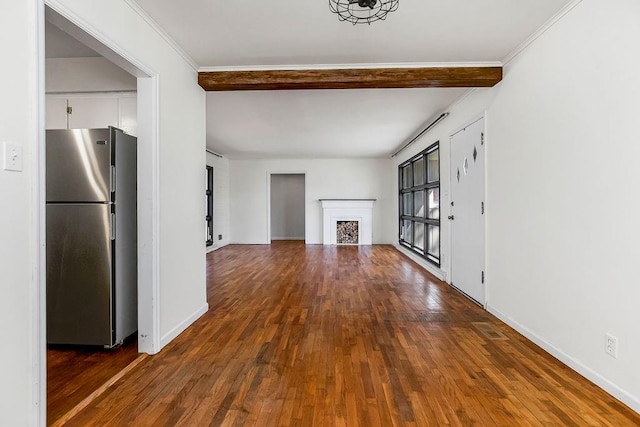 unfurnished living room with ornamental molding, a fireplace, wood-type flooring, and baseboards