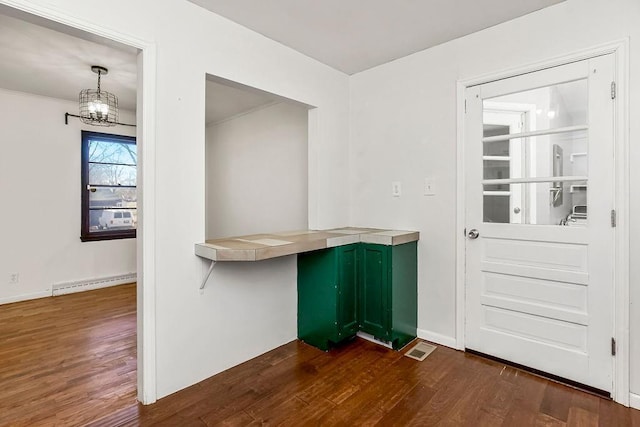 interior space featuring a chandelier, dark wood-style flooring, baseboards, and baseboard heating