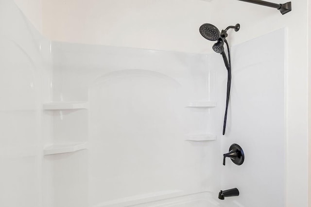 room details featuring bathtub / shower combination